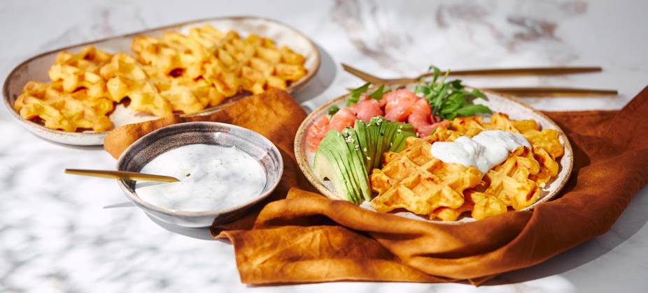Hearty sweet potato or pumpkin waffles with avocado, salmon, arugula and sauce Hearty sweet potato or pumpkin waffles with avocado, salmon, arugula and sauce Copyright: xZoonar.com BurakovaxIrinax 21518000