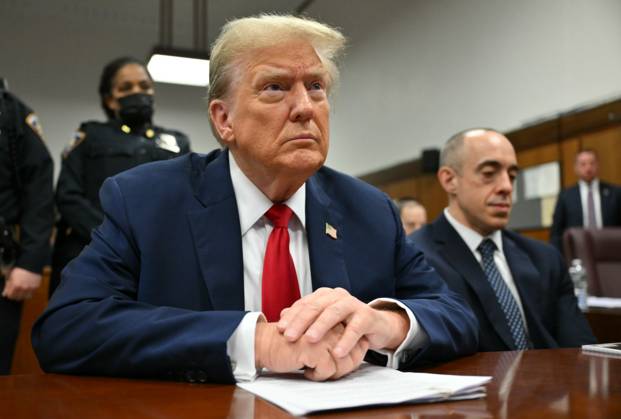 Former President Donald Trump waits for his trial to begin at Manhattan Criminal Court in New York on Thursday, May 16, 2024. Michael Cohen, a one-time fixer and personal attorney to Trump, is expected to continue testifying in the hush-money criminal trial against the former president. Pool photo by Angela Weiss  NYP20240516709 AngelaxWeiss