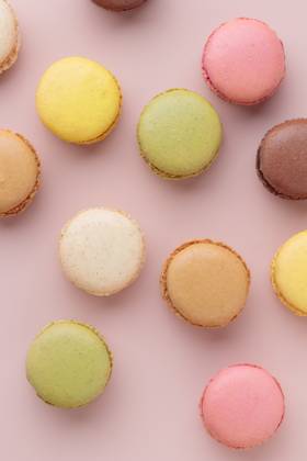 Macaroons on pink background, colorful french cookies pattern. Gift for 8 March, International Women s Day, Valentine Day Macaroons on pink background, colorful french cookies pattern. Gift for 8 March, International Women s Day, Valentine Day. Vertical Copyright: x RECORD DATE NOT STATED