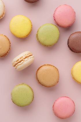 Macaroons on pink background, colorful french cookies pattern. Gift for 8 March, International Women s Day, Valentine Day Macaroons on pink background, colorful french cookies pattern. Gift for 8 March, International Women s Day, Valentine Day. Vertical Copyright: x RECORD DATE NOT STATED