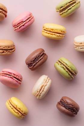 Macaroons on pink background, colorful french cookies pattern. Gift for 8 March, International Women s Day, Valentine Day Macaroons on pink background, colorful french cookies pattern. Gift for 8 March, International Women s Day, Valentine Day. Vertical Copyright: x RECORD DATE NOT STATED