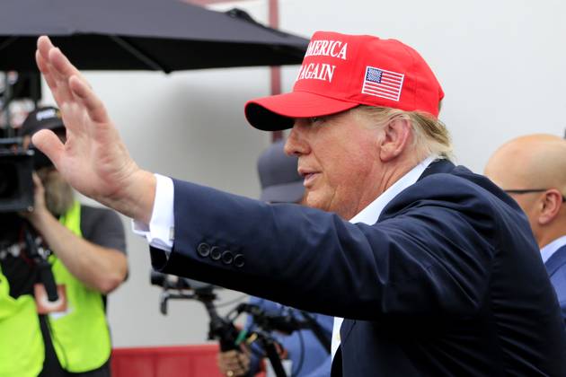 CHARLOTTE, NC - MAY 26: Former President of the United States of America Donald Trump waves to the crowd on pit road prior to the running of the NASCAR Cup Series Coca-Cola 600 on May 26, 2024 at Charlotte Motor Speedway in Charlotte, NC. (Photo by Jeff Robinson Icon Sportswire) EDITORIAL USE ONLY Icon1045686866