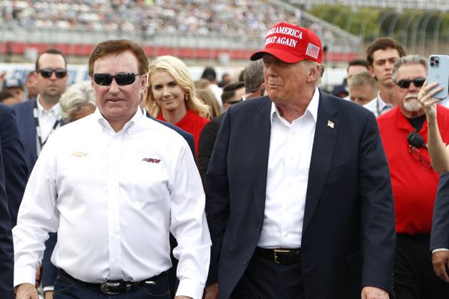 CHARLOTTE, NC - MAY 26: Former President of the United States of America Donald Trump walks down pit road with Richard Childress on pit road prior to the running of the NASCAR Cup Series Coca-Cola 600 on May 26, 2024 at Charlotte Motor Speedway in Charlotte, NC. (Photo by Jeff Robinson Icon Sportswire) EDITORIAL USE ONLY Icon1045694110