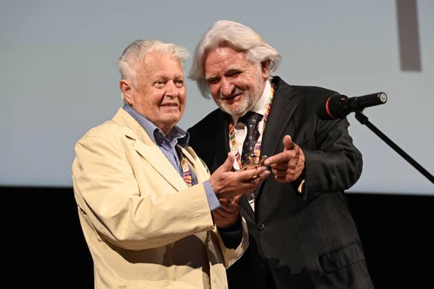 Czech film director Hynek Bocan, left, receives the Golden Slipper award for outstanding contribution to Czech film at the 64th Zlin Film Festival, international film festival for children and youth, in Zlin, Czech Republic, on May 30, 2024. On the right side is seen Cestmir Vancura, president of festival. (CTKxPhoto DaliborxGluck) CTKPhotoP2024053008421  CTKPhotoP2024053008421