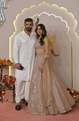 Wedding red carpet of Anant Ambani & Radhika Merchant in Mumbai, India - 12 Jul 2024 Bollywood actor and film producer John Abraham pose for a photo with his wife Priya Runchal (R) on the red carpet wedding ceremony of Anant Ambani and Radhika Merchant in Mumbai. Mumbai India Copyright: xAshishxVaishnavx xSOPAxImagesx AVaishnav_Wedding red carpet of Anant Ambani _ Radhika Merchant in Mumbai, India (29)