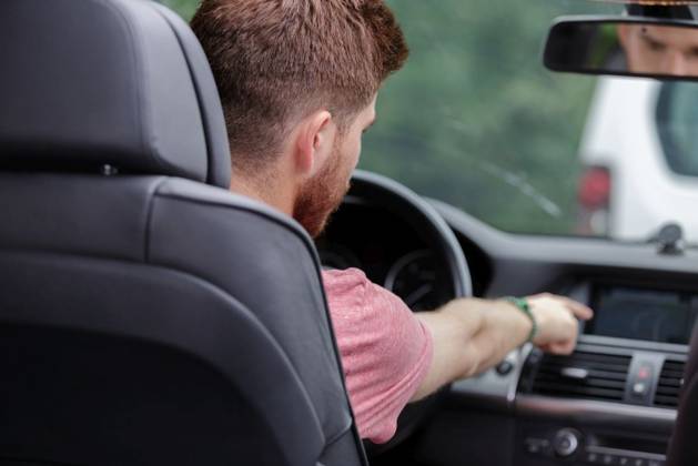 a young man driving a car ,model released, Symbolfoto