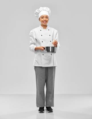 culinary and people concept - happy smiling female chef in toque and jacket with saucepan cooking food over grey background. happy smiling female chef with saucepan ,model released, Symbolfoto