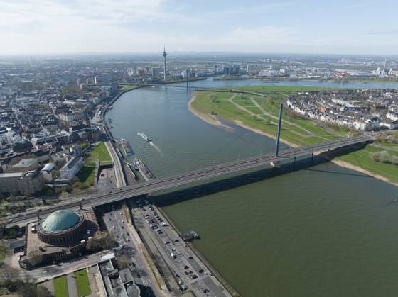 Aerial drone view over Dusseldorf, including the Rhine River and the Oberkasseler Brucke, capturing their scenic and architectural features. Aerial photo. Aerial drone view over Dusseldorf, including the Rhine River and the Oberkasseler Brucke, capturing their scenic and architectural features. Copyright: xZoonar.com HugoxKurkx 21699463