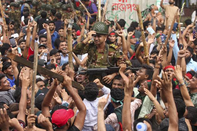 August 5, 2024, Dhaka, Dhaka, Bangladesh: Anti-government protestors celebrate in Dhaka on August 5, 2024. Protests in Bangladesh that began as student-led demonstrations against government hiring rules in July culminated on August 5, in the prime minister fleeing and the military announcing it would form an interim government. Dhaka Bangladesh - ZUMAj163 20240805_zip_j163_009 Copyright: xAbuxSufianxJewelx