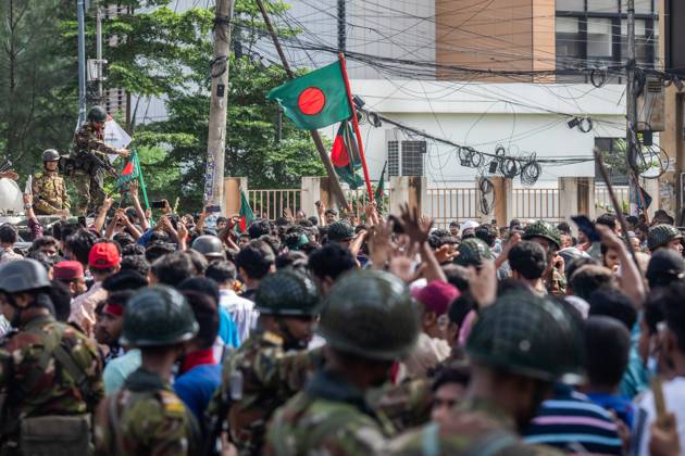 August 5, 2024, Dhaka, Bangladesh: Anti-government protestors participate in the celebrations. Thousands of people are celebrating the resignation of Bangladeshi Prime Minister Sheikh Hasina..Protests in Bangladesh that began as student-led demonstrations against government hiring rules in July culminated on August 5, in the prime minister fleeing and the military announcing it would form an interim government. Dhaka Bangladesh - ZUMAs197 20240805_aaa_s197_073 Copyright: xSazzadxHossainx