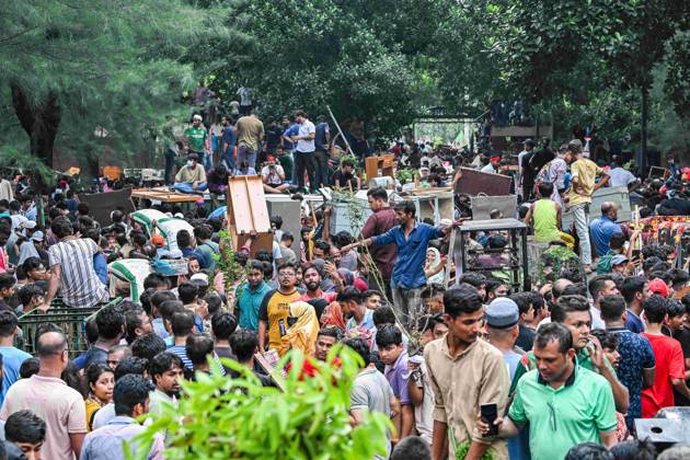 August 5, 2024, Dhaka, Bangladesh: Anti-government protestors gather at the Prime Minister Sheikh Hasina s place during the celebrations. Thousands of Bangladesh People celebrate the resignation of Bangladeshi Prime Minister Sheikh Hasina. Protests in Bangladesh that began in July for the abolition of the quota system in government jobs culminated on August 5, as Bangladesh military chief Gen. Waker-uz-Zaman announced a transitional government after Prime Minister Sheikh Hasina fled the country due to violent nationwide protests. Hundreds of people were killed and wounded during the protests since July, which first called for the abolition of quotas in government jobs and later the resignation of the Hasina, who had been in power since 2009 - ZUMAs197 20240805_aaa_s197_146 Copyright: xZabedxHasnainxChowdhuryx
