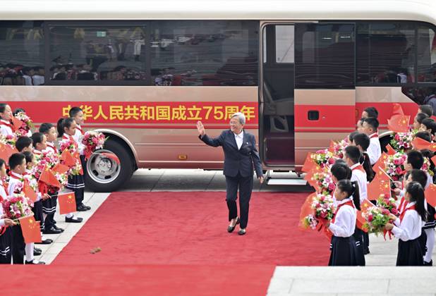 (240929) -- BEIJING, Sept. 29, 2024 -- Lu Shengmei, a recipient of the title of People s Health Worker, arrives at the Great Hall of the People in Beijing, capital of China, Sept. 29, 2024. China held a high-profile ceremony on Sunday morning to award the highest state honors ahead of the 75th founding anniversary of the People s Republic of China. ) (FOCUS)CHINA-BEIJING-HIGHEST STATE HONORS-CEREMONY (CN) LixXiang 