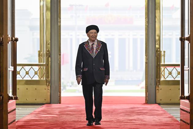 (240929) -- BEIJING, Sept. 29, 2024 -- Bayika Kalidibek, a recipient of the title of People s Guard, arrives at the Great Hall of the People in Beijing, capital of China, Sept. 29, 2024. China held a high-profile ceremony on Sunday morning to award the highest state honors ahead of the 75th founding anniversary of the People s Republic of China. ) (FOCUS)CHINA-BEIJING-HIGHEST STATE HONORS-CEREMONY (CN) YinxBogu 
