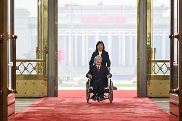 (240929) -- BEIJING, Sept. 29, 2024 -- Zhang Jinfan, a recipient of the title of People s Educator, arrives at the Great Hall of the People in Beijing, capital of China, Sept. 29, 2024. China held a high-profile ceremony on Sunday morning to award the highest state honors ahead of the 75th founding anniversary of the People s Republic of China. ) (FOCUS)CHINA-BEIJING-HIGHEST STATE HONORS-CEREMONY (CN) YinxBogu 