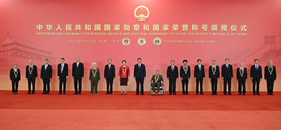 (240929) -- BEIJING, Sept. 29, 2024 -- Chinese President Xi Jinping, also general secretary of the Communist Party of China (CPC) Central Committee and chairman of the Central Military Commission, and other leaders have group photos taken with the recipients of national medals and national honorary titles of the People s Republic of China in Beijing, capital of China, Sept. 29, 2024. A presentation ceremony for national medals and national honorary titles of the People s Republic of China was held at the Great Hall of the People in Beijing on Sunday. ) CHINA-BEIJING-NATIONAL MEDALS AND HONORARY TITLES-PRESENTATION CEREMONY (CN) LixXueren 