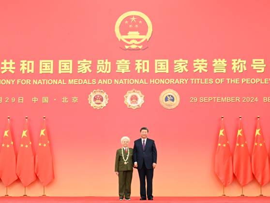 (240929) -- BEIJING, Sept. 29, 2024 -- Chinese President Xi Jinping, also general secretary of the Communist Party of China (CPC) Central Committee and chairman of the Central Military Commission, presents the medal for the title of People s Artist to Tian Hua in Beijing, capital of China, Sept. 29, 2024. A presentation ceremony for national medals and national honorary titles of the People s Republic of China was held at the Great Hall of the People in Beijing on Sunday. ) CHINA-BEIJING-NATIONAL MEDALS AND HONORARY TITLES-PRESENTATION CEREMONY (CN) XiexHuanchi 