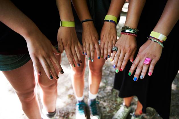 Hands, manicure and woman friends at music festival together, in a circle outdoor closeup from above. Party, concert or show with a group of people at a carnival for performance or entertainment. model released property released Copyright: xwww.PeopleImages.comxLicensexRestrictionsxApplyx