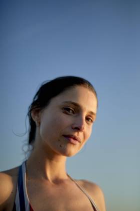 Creative Highlights Symbolfotos Portrait of a young woman with a serene expression against a clear blue sky at dusk. bola03240 Copyright: xConnectxImagesx ,model released