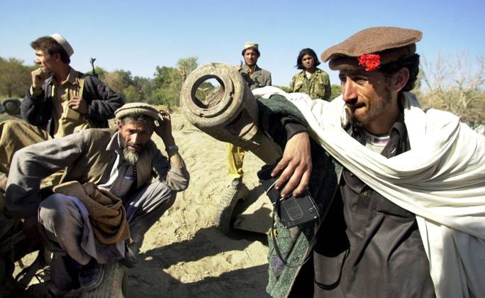 AFGHANISTAN 011118 Aref and his Northern Alliance friends listen to the radio after a five-year ban x57x  Copyright: xErichxSteringx