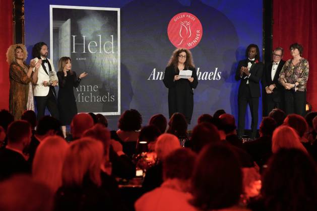 November 18, 2024, Toronto, Ontario, Canada: ANNE MICHAELS, 66, accepts the Giller Prize of $100,000 for her book Held a multigenerational look at war and trauma spanning more than a century. The jury cited the novel as an impactful and hypnotic exploration of mortality, resilience and desires, at ceremony in Toronto, Monday. Award boycotted by several prominent Canadian authors over its sponsors’ ties to Israel. Based in Toronto, Michaels a poet and author. In her acceptance speech, said that her writing is a way of bearing witness against war, indifference, against amnesia of every sort. Toronto Canada - ZUMAc35_ 20241118_zaf_c35_172 Copyright: xChrisxYoungx