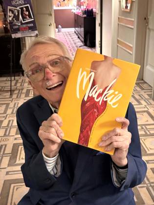 December 2, 2024, New York, New York, USA: American fashion designer and costumier BOB MACKIE holds his UNMISTAKABLY MACKIE book at the press preview for the Hollywood Legends Ã¢â‚¬ËœUnmistakably MackieÃ¢â‚¬â ¢ auction presented by JulienÃ¢â‚¬â ¢s Auctions and Turner Classic Movies held at the Carlyle Hotel. New York USA - ZUMAk03_ 20241202_zaf_k03_079 Copyright: xNancyxKaszermanx