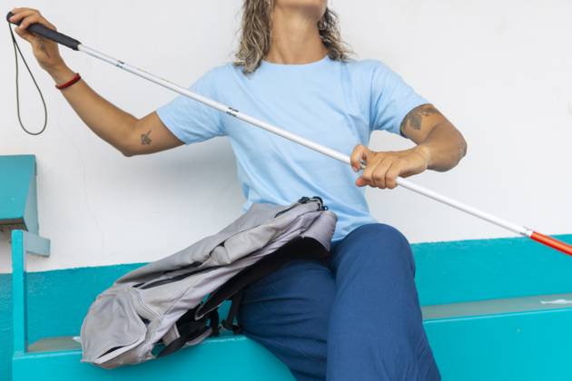 A woman confidently navigates her environment using a white cane Her determination and adaptability in daily tasks highlight resilience despite hearing and sight challenges Model Released JuanAizpuru_ID25147_727808_016 Copyright: xJuanxAizpurux