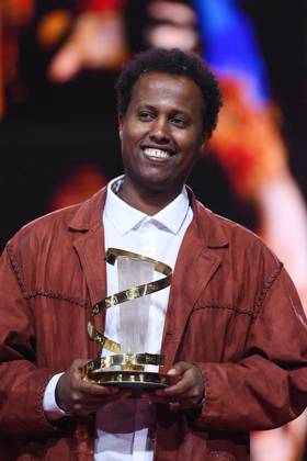 Marrakech Closing Ceremony Director Mo Harawe receives the award for The village next to Paradise attending the Closing Ceremony during the 21st Marrakech International Film Festival in Marrakech, Morocco on December 07, 2024. Photo by Aurore Marechal ABACAPRESS.COM Marrakech Morocco  Copyright: xMarechalxAurore ABACAx