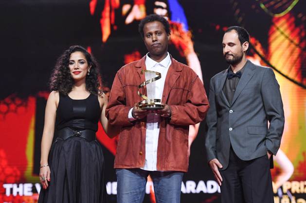 Marrakech Closing Ceremony Nadia Kounda, Director Mo Harawe receives the award for The village next to Paradise and Ali Abbasi during the Closing Ceremony during the 21st Marrakech International Film Festival in Marrakech, Morocco on December 07, 2024. Photo by Aurore Marechal ABACAPRESS.COM Marrakech Morocco  Copyright: xMarechalxAurore ABACAx