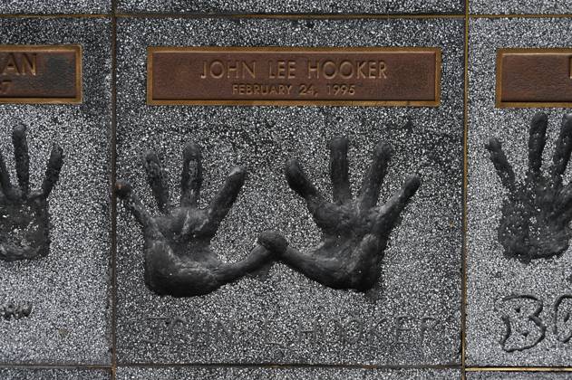Handprints of John Lee Hooker on the rock walk in the entrance to the Guitar Center Music Store on Sunset Boulevard, Hollywood, Los Angeles, California, USA