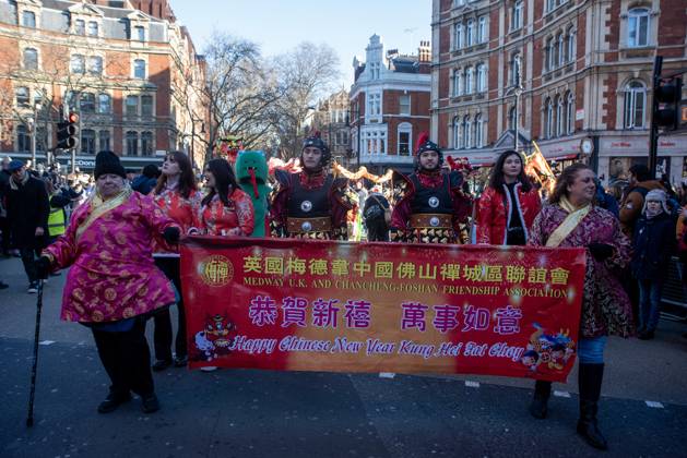February 2, 2025, London, United Kingdom: People walk with a banner during the parade on the celebration of the Chinese New Year. People gathered in central London for the Lunar New Year parade from the Trafalgar Square to Chinatown. Participants and the crowds welcomed the Year of the Snake. The event is considered of the largest Lunar New Year outside Asia. London United Kingdom - ZUMAs197 20250202_aaa_s197_493 Copyright: xKrisztianxElekx