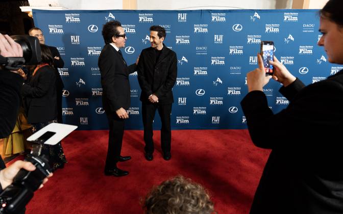 February 13, 2025, Santa Barbara, California, USA: Adrien Brody is greeted by Festival Executive Director Roger Durling as he arrives at the red carpet Thursday night to receive the Cinema Vanguard Award at the 40th annual Santa Barbara International Film Festival. Spotlighting their performances in Brady CorbetÃ¢â‚¬â ¢s THE BRUTALIST, BrodyÃ¢â‚¬â ¢s portrayal of Toth highlights an immigrantÃ¢â‚¬â ¢s struggle to overcome his war-torn past and rebuild his life in a Post-War America. Pearce, in contrast, delivers a chilling, domineering performance as a wealthy art patron whose vision of American modernity collides with TothÃ¢â‚¬â ¢s. The tension between the two not only drives the narrative but also symbolizes the larger struggle between inn - ZUMAa35_ 20250213_zaf_a35_019 Copyright: xDanielxA.xAndersonx