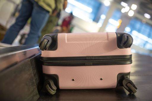 The luggage belt with suitcases being delivered to the passengers at the arrival terminal 22226016 RECORD DATE NOT STATED