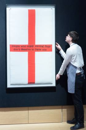 Bonhams 20th 21st Century Art Day Evening Sales Highlights Photocall - Bonhams, London An art handler holds People Who Enjoy Waving Flags Don t Deserve To Have One by Banksy (est £80k - £120k) which is to go on auction at Bonhams 20th 21st Century Art Day Evening Sales at Bonhams in London, England, UK on Monday 31 March, 2025., Credit:Justin Ng Avalon UK, England, London, Bonhams Copyright: xJustinxNgx xAvalonx 0981806327