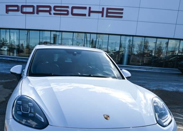 Trump™s 25% Tariff On Imported Vehicles And Auto Parts To Impact Jobs And Economy EDMONTON, CANADA APRIL 2: A file picture of a Porsche vehicle parked outside a Porsche dealership in Edmonton, Alberta, Canada, on April 2, 2025. U.S. President Donald Trump s administration announced a 25% tax on fully-built vehicles and essential auto parts, including engines and transmissions, which will go into effect on April 3. Edmonton Canada  Copyright: xArturxWidakx originalFilename: widak-trumps25250402_nprWB.jpg