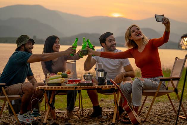 Beautiful Caucasian woman use mobile phone to selfie with her friend during camping and enjoy together near lake with sunset and they look happy for party outdoor., model released, , 59068286.jpg, outdoors, picnic, party, cheers, drink, eating, sunset, activity, campfire, carefree, casual, lifestyle, asian, beer, camp, adult, adventure, caucasian, enjoying, freedom, friends, friendship, fun, group, guitar, happiness, happy, holiday, joy, joyful, laughing, leisure, nature, outdoor, people, play, portrait, recreation, relaxation, sitting, summer, together, togetherness, travel, trip, twilight, vacation, weekend, young RECORD DATE NOT STATED