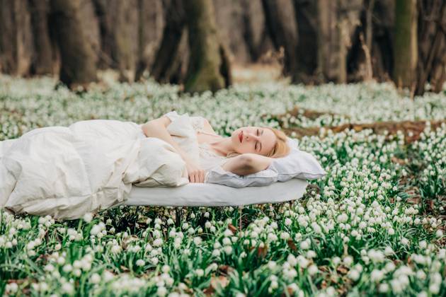 Creative Highlights Symbolfotos Woman waking up in a forest meadow surrounded by lilies of the valley model released, Symbolfoto, VSNF03000
