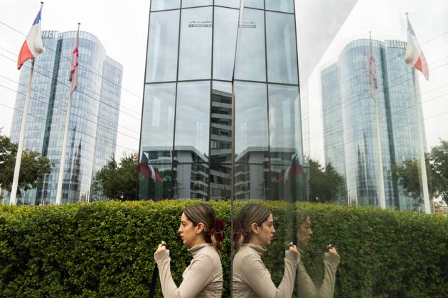 April 23, 2025, Santiago, Metropolitana, Chile: A woman is reflected in a billboard in Santiago, Chile. Santiago Chile - ZUMAb332 20250423_zip_b332_004 Copyright: xMatiasxBasualdox