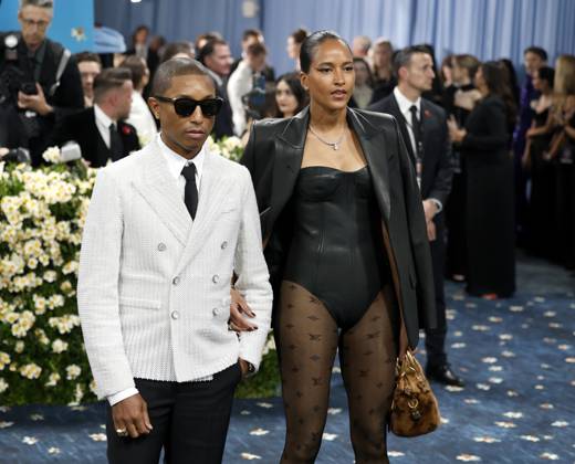 Pharrell Williams and Helen Lasichanh arrive on the red carpet at the 2025 Met Gala celebrating the opening of Superfine: Tailoring Black Style at The Metropolitan Museum of Art on Monday, May 5, 2025 in New York City.  NYP20250505109 JOHNxANGELILLO