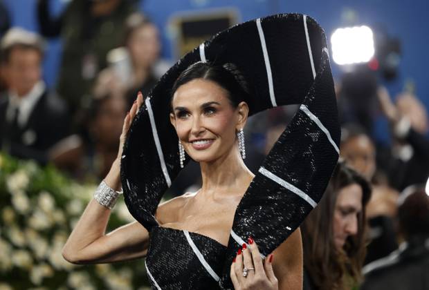 Demi Moore arrives on the red carpet at the 2025 Met Gala celebrating the opening of Superfine: Tailoring Black Style at The Metropolitan Museum of Art on Monday, May 5, 2025 in New York City.  NYP20250505124 JOHNxANGELILLO
