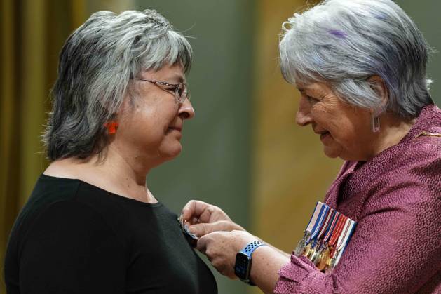 June 25, 2025, Ottawa, On, Canada: Gov. Gen. Mary Simon pins a Meritorious Service Cross on Phyllis Webstad of Williams Lake, B.C., during a ceremony at Rideau Hall in Ottawa, on Wednesday, June 25, 2025. Webstad inspired Orange Shirt Day, which is observed on September 30, where Canadians show their support for residential school survivors by wearing orange. Ottawa Canada - ZUMAc35_ 20250625_zaf_c35_057 Copyright: xJustinxTangx