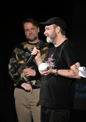 Lukas Moodysson, Swedish poet, novelist, film director and non-conformist, one of the most prominent personalities of the local culture in general, receives the ACFK Annual Award within the 51st Summer Film School in Uherske Hradiste, Czech Republic, July 27, 2025. On the left is programme director Jan Jilek. (CTKxPhoto DaliborxGluck) CTKPhotoP2025072705405  CTKPhotoP2025072705405