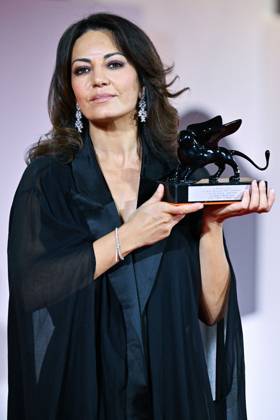 Venice Winners Red Carpet AM Maryam Touzani poses with the Venice Spotlight Armani Beauty Audience Award for Calle Malaga attending the Winners Red Carpet of the 82nd Venice International Film Festival at the Lido in Venice, Italy on September 06, 2025. Photo by Aurore Marechal ABACAPRESS.COM Venice Italy  Copyright: xMarechalxAurore ABACAx