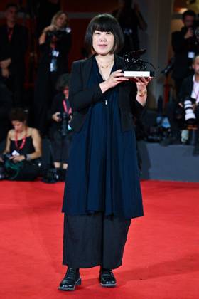 Venice Winners Red Carpet AM Singing Chen poses with the Grand Prize for The Clouds Are Two Thousand Meters Up attending the Winners Red Carpet of the 82nd Venice International Film Festival at the Lido in Venice, Italy on September 06, 2025. Photo by Aurore Marechal ABACAPRESS.COM Venice Italy  Copyright: xMarechalxAurore ABACAx