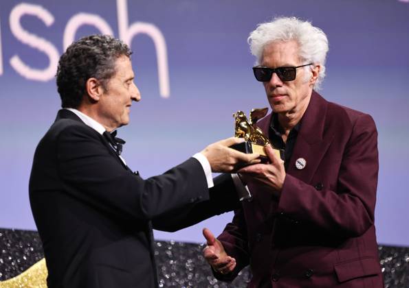 (250907) -- VENICE, Sept. 7, 2025 -- President of the 2025 Venice Biennale Pietrangelo Buttafuoco (L) presents the trophy to American director Jim Jarmusch at the awarding ceremony of the 82nd Venice International Film Festival in Venice, Italy, Sept. 6, 2025. American director Jim Jarmusch s Father Mother Sister Brother won the Golden Lion for Best Film. The 82nd edition of the Venice International Film Festival ran from Aug. 27 to Sept. 6 at the Lido island of the Italian lagoon city, with 21 films in the main competition lineup. ) ITALY-VENICE-FILM FESTIVAL-AWARDING CEREMONY LixJing 