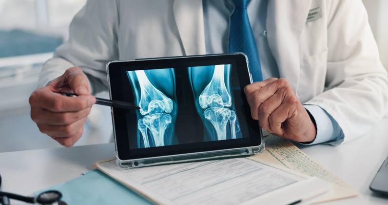 Hands, screen and tablet for x ray with knee, scan or osteoporosis with point at hospital. Doctor, application and ux for medical consultation for arthritis, feedback or report for wellness at clinic Hands, screen and tablet for x ray with knee, scan or osteoporosis with point at hospital. Doctor, application and ux for medical consultation for arthritis, feedback or report for wellness at clinic., model released, , property released, , 97604214.jpg RECORD DATE NOT STATED