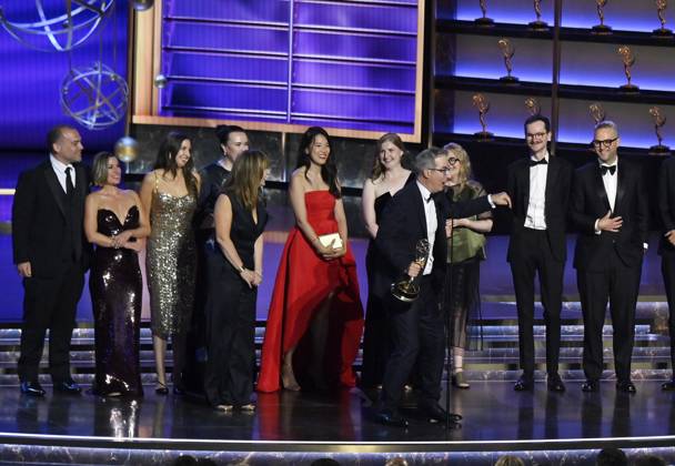 John Oliver (C) accepts the Outstanding Scripted Variety Series award for Last Week Tonight with John Oliver onstage at the 77th annual Primetime Emmy Awards at the Peacock Theater in Los Angeles on Sunday, September 14, 2025.  LAP2025091480488 JIMxRUYMEN