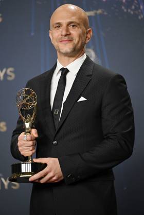 Adam Randall holds the Emmy for Outstanding Directing for a Drama Series for Slow Horses, backstage during the 77th annual Primetime Emmy Awards at the Peacock Theater in Los Angeles on Sunday, September 14, 2025.  LAP20250914193 CHISxCHEW