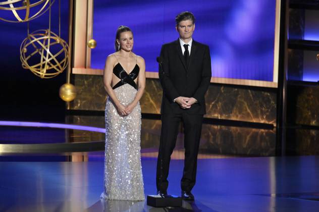 Kristen Bell and Michael Schur speak onstage at the 77th annual Primetime Emmy Awards at the Peacock Theater in Los Angeles on Sunday, September 14, 2025.  LAP202509143037 JIMxRUYMEN