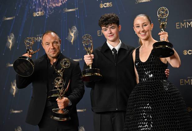 (L-R) Stephen Graha holds the Emmy for Outstanding Limited or Anthology Series, Outstanding Lead Actor in a Limited or Anthology Series or Movie, Outstanding Writing for a Limited Series or Anthology Series or Movie for Adolescence , Owen Cooper holds the Emmy for Outstanding Supporting Actor in a Limited or Anthology Series or Movie for Adolescence, and Erin Doherty holds the Emmy for Outstanding Supporting Actress in a Limited or Anthology Series or Movie award for Adolescence, backstage during the 77th annual Primetime Emmy Awards at the Peacock Theater in Los Angeles on Sunday, September 14, 2025.  LAP20250914294 CHISxCHEW