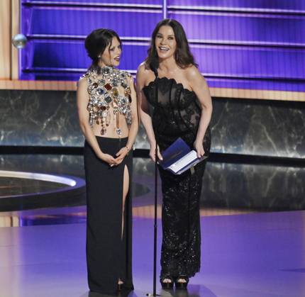 Jenna Ortega (L) and Catherine Zeta-Jones appear onstage at the 77th annual Primetime Emmy Awards at the Peacock Theater in Los Angeles on Sunday, September 14, 2025.  LAP20250914918 JIMxRUYMEN